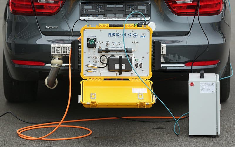 KLETTWITZ, GERMANY - NOVEMBER 25: A PEMS (Portable Emissions Measurement System) device for testing the emissions of cars in real driving situations is seen attached to the exhaust pipe of a car during a workshop for media on automobile emissions at the DEKRA testing facility on November 25, 2015 in Klettwitz, Germany. European authorities are reconsidering their emissions testing procedures for cars in the wake of the Volkswagen diesel emissions cheating scandal. DEKRA is Germany's biggest independent automotive technical testing agency. (Photo by Sean Gallup/Getty Images)