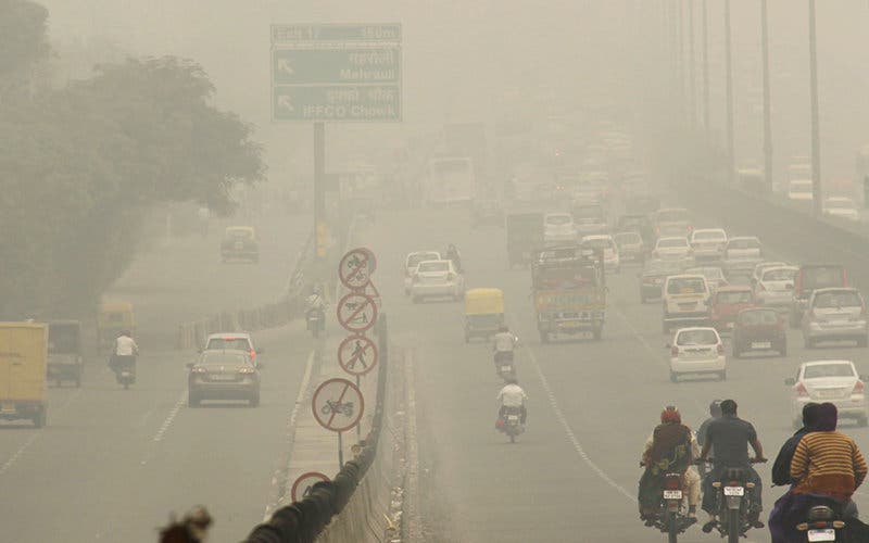 GURGAON, INDIA  NOVEMBER 5: Due to weather changes the city came under a thick blanket of smog on November 5, 2013 in Gurgaon, India. The Met Office has forecast a cloudy day. The city experienced similar weather on Monday and the maximum temperature was recorded two notches below the season's average at 28.3 degrees Celsius, while the minimum was 12.6 degrees Celsius- three notches below the season's average. (Photo by Manoj Kumar/Hindustan Times via Getty Images)