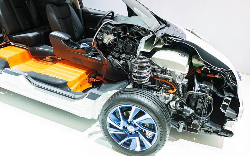 Brussels, Belgium - Januari 12, 2016: Open Nissan Leaf full electric car with a visible electric drivetrain and orange battery pack. Leaf stand for leading environmentally-friendly affordable family car and it is an an all-electric car, that produces no tailpipe pollution or greenhouse gas emissions. The car is on display during the 2016 Brussels Motor Show.