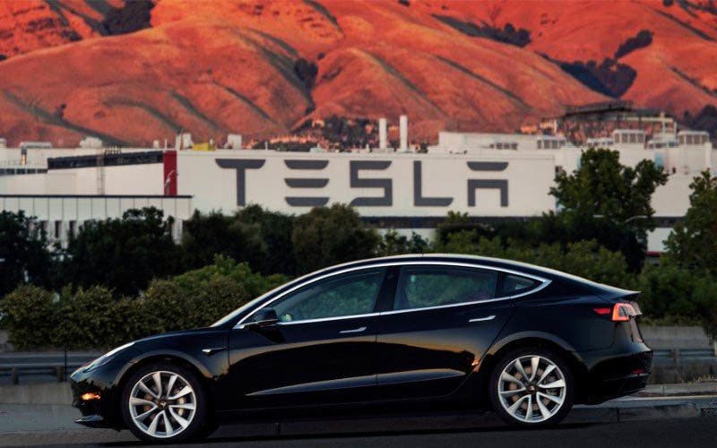 FILE PHOTO: First production model of Tesla Model 3 out the assembly line in Fremont, California , U.S. is seen in this undated handout photo from Tesla Motors obtained by Reuters July 10, 2017.   Tesla Motors/Handout via REUTERS