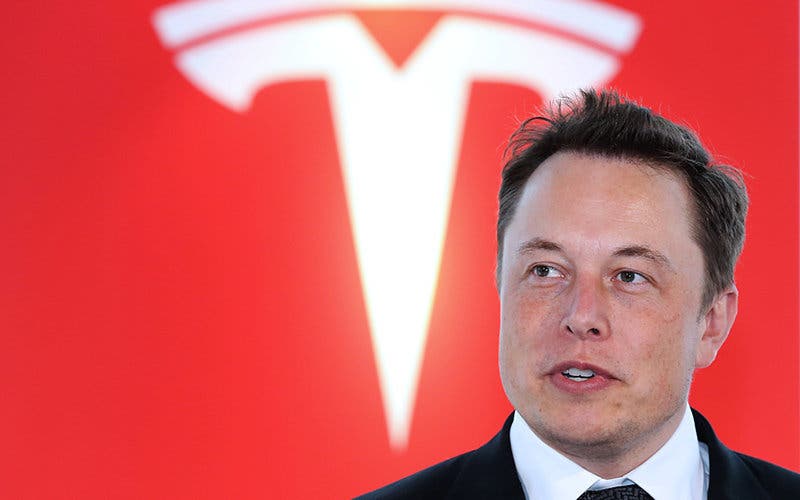 Elon Musk, co-founder and chief executive officer of Tesla Motors Inc., attends a key delivery ceremony of the company's premium electric sedan Model S vehicles to customers in Tokyo, Japan, on Monday, Sept. 8, 2014. Tesla may partner with Toyota Motor Corp. again in the future, Musk said. Photographer: Yuriko Nakao/Bloomberg via Getty Images