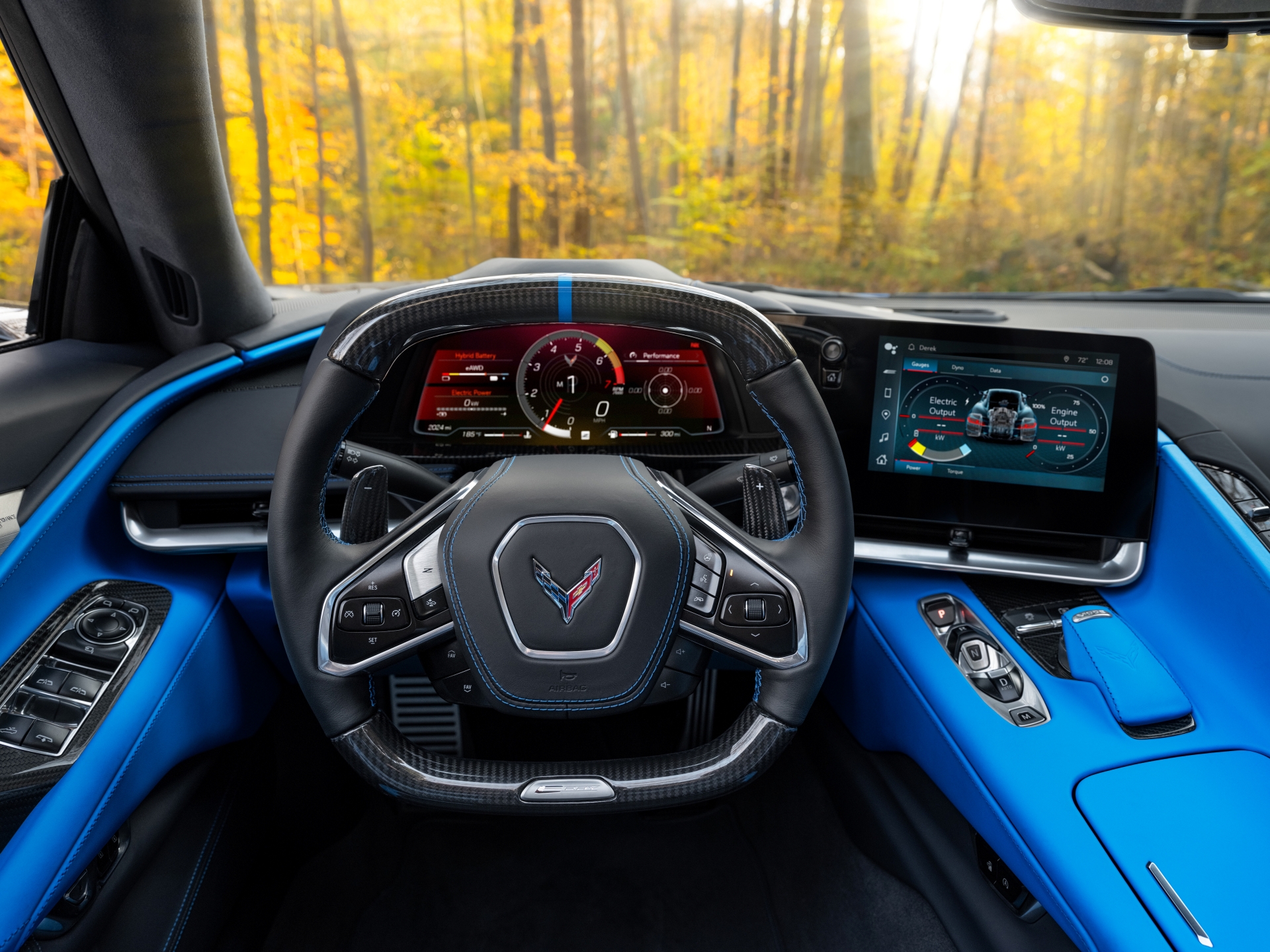View from driver’s seat in 2024 Chevrolet Corvette E-Ray 3LZ coupe in Silver Flare with Two Tone Blue Interior. Pre-production model shown. Actual production model may vary. Model year 2024 Corvette E-Ray available 2023.