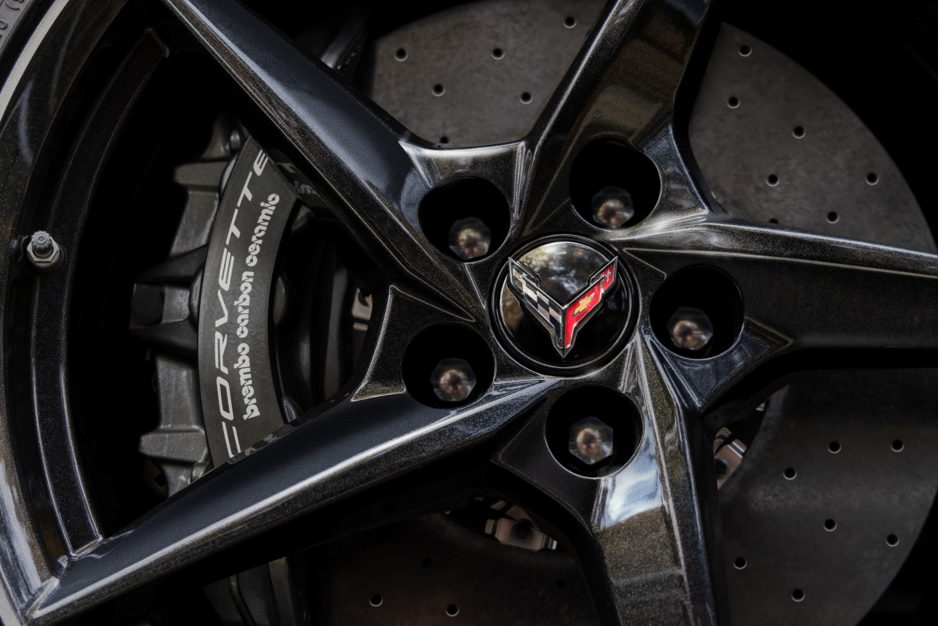Close up view of aluminum wheel with Gloss Black finish on 2024 Chevrolet Corvette E-Ray 3LZ. Pre-production model shown. Actual production model may vary. Model year 2024 Corvette E-Ray available 2023.